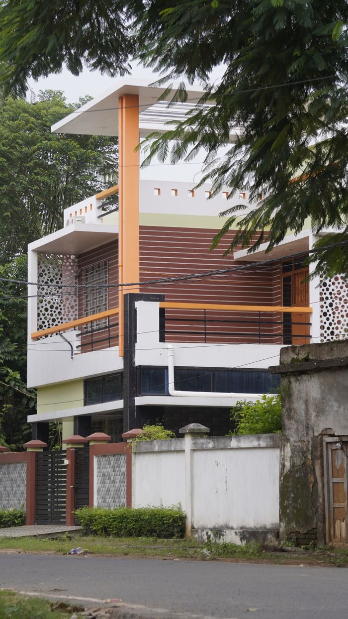 A stylish modern house featuring unique architectural elements and a vibrant facade.